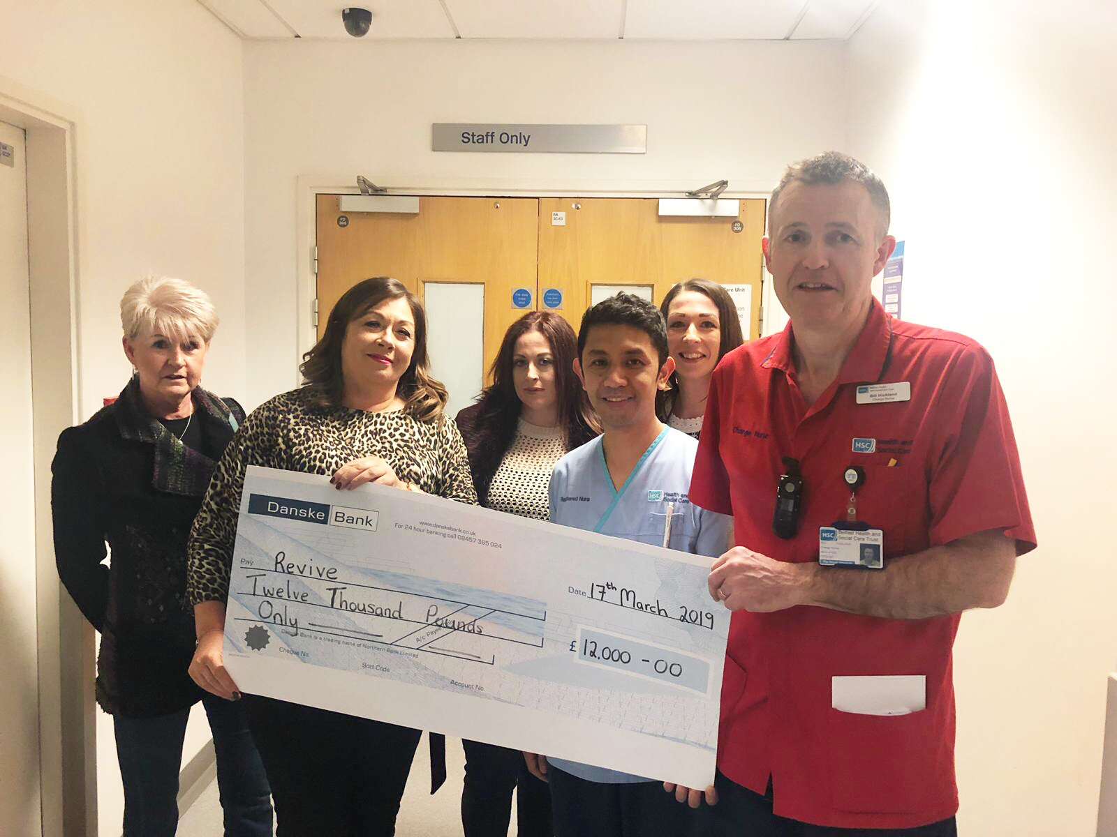 The family of Niall Lyttle present the cheque to the staff from the RVH Intensive Care Unit\n\n