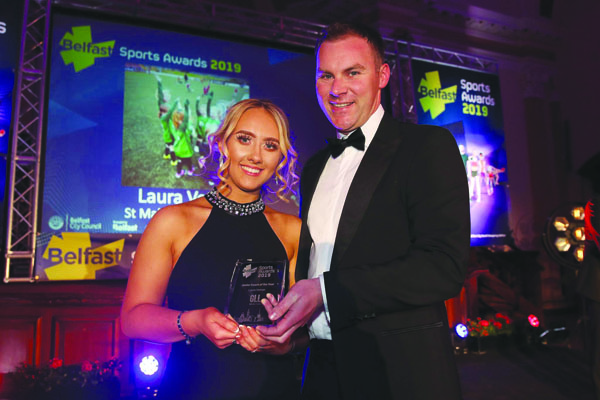 St Malachy’s OB and Ardoyne Kickhams coach, Laura Vernon picks up her Young Coach of the Year award from Gareth Kirk, GLL, at the recent Belfast City Council Sports Awards at the City Hall