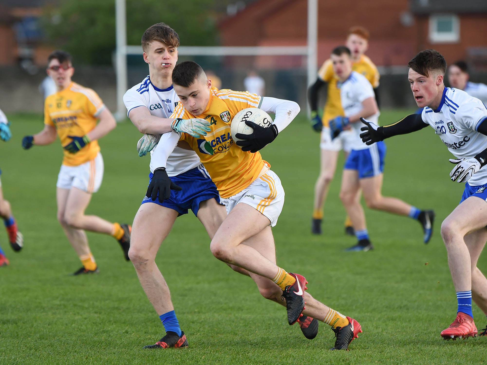 Antrim defender Michael Ferris comes under pressure from Monaghan’s Karl Gallagher during Saturday’s Ulster Minor Football Championship clash at Corrigan Park with the Farneymen claiming a narrow one-point win 