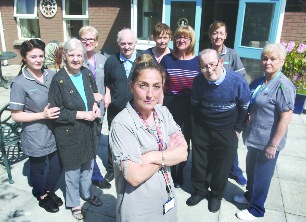 TEAMWORK: Staff and residents of Bruce House in Duncairn Avenue, which provides a supportive and stimulating environment for people living with dementia