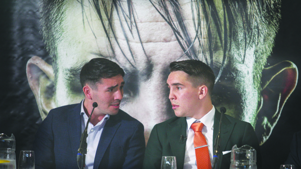 Michael Conlan deep in conversation with older brother, Jamie during Tuesday’s press conference