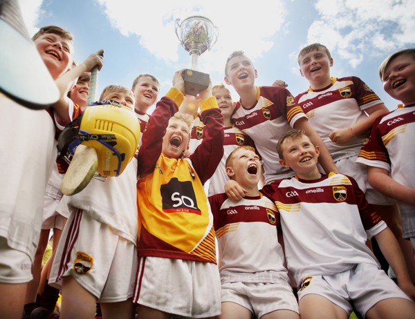 Delighted young Bunscoil Tsléibhe Dhuibh hurlers celebrate their Antrim Schools Final victory at Musgrave