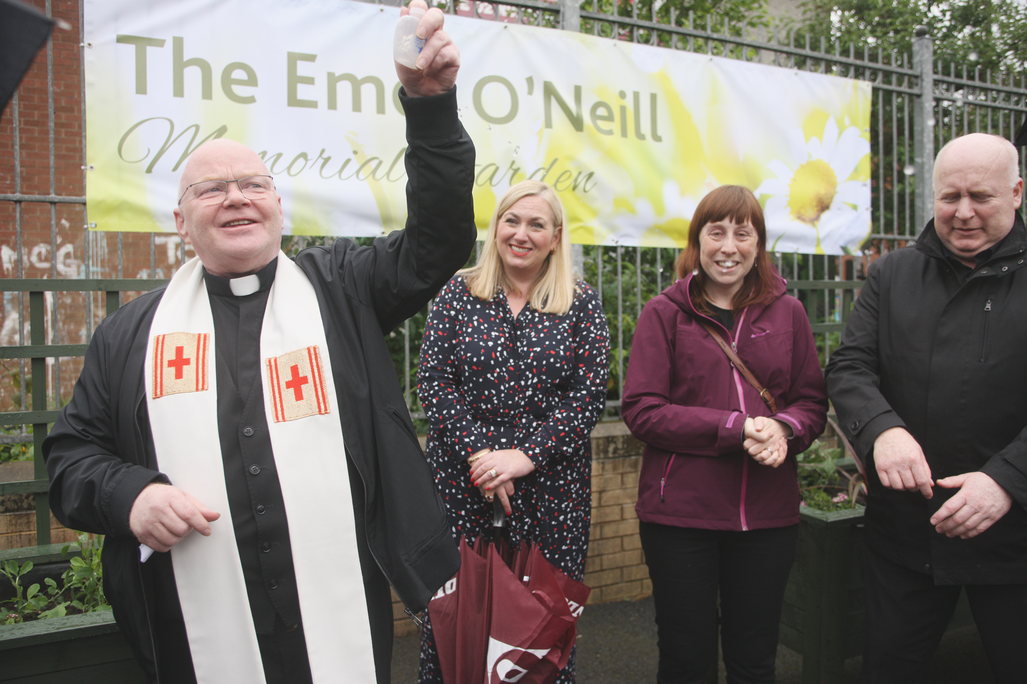 IN MEMORY: Fr Devlin blesses the new memorial garden in St Clare\'s Primary School, which is dedicated to the school\'s late caretaker Emer O\'Neill