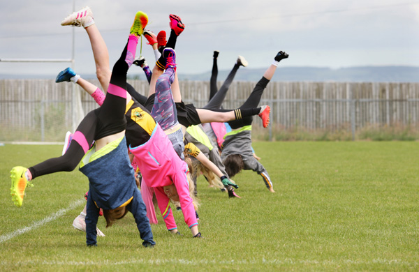 Cartwheeling for joy as school ends and summer begins at the Naomh Eanna Cul Camp in Glengormley