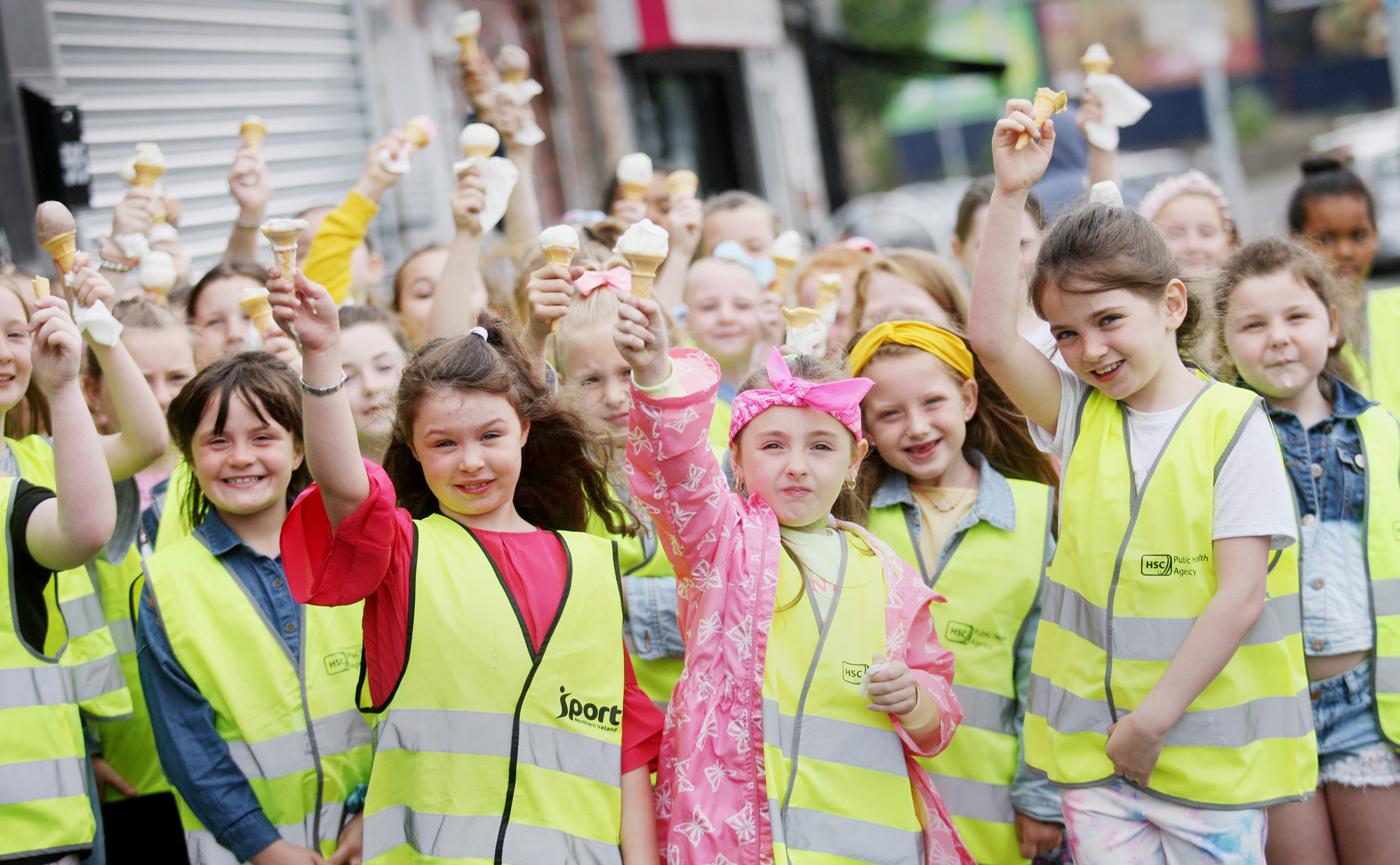Girls from Mercy PS Summer Scheme in Ardoyne cool down with ice cream as the temperature rose