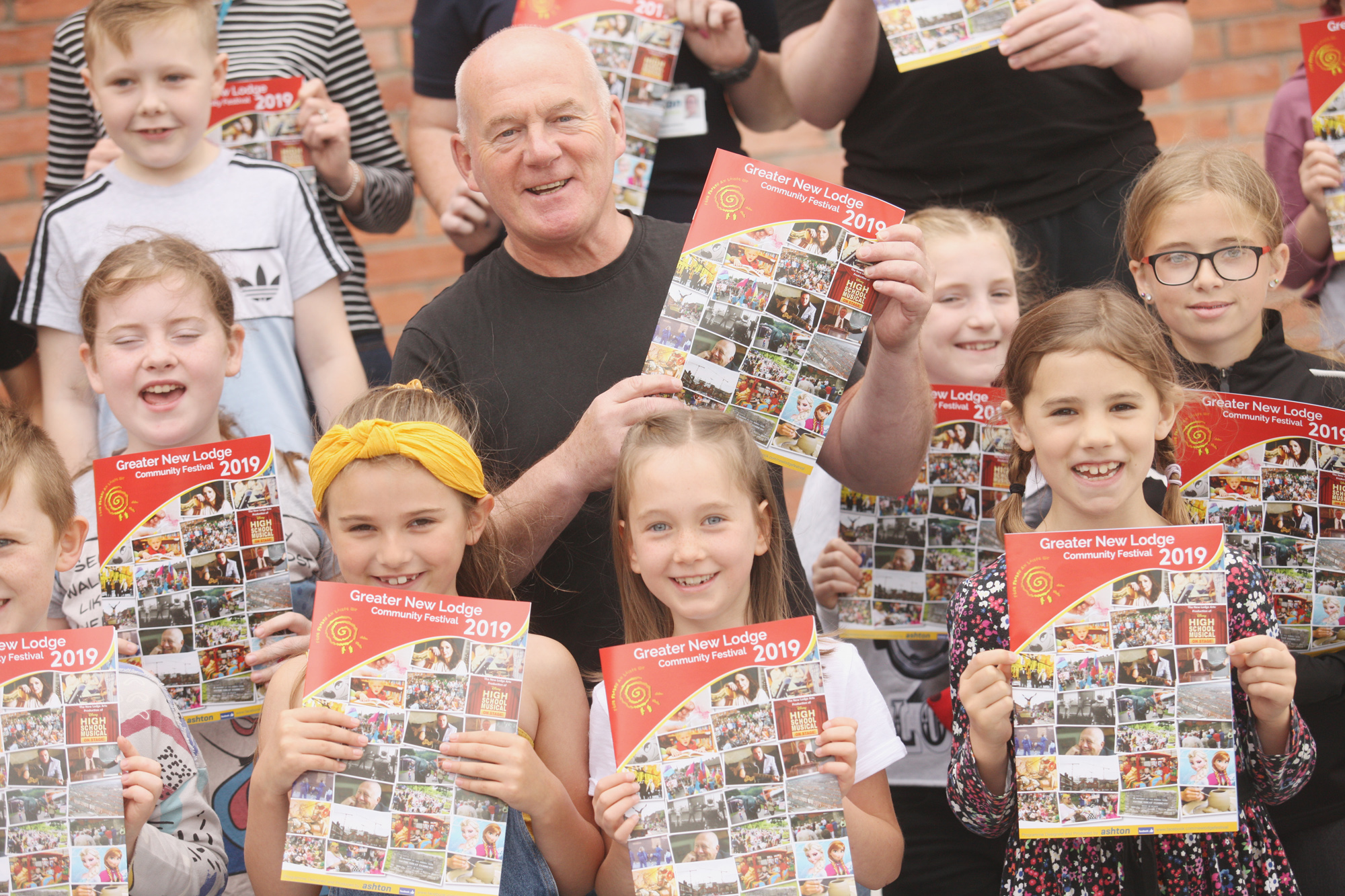 Paul O\'Neill joins local children for the launch of the Greater New Lodge Community Festival at the Girdwood Community Hub