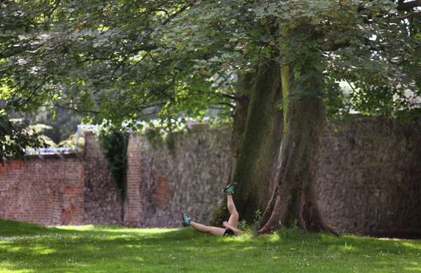 PULL THE OTHER ONE: A jogger stretching before a summer workout in the Ormeau Park