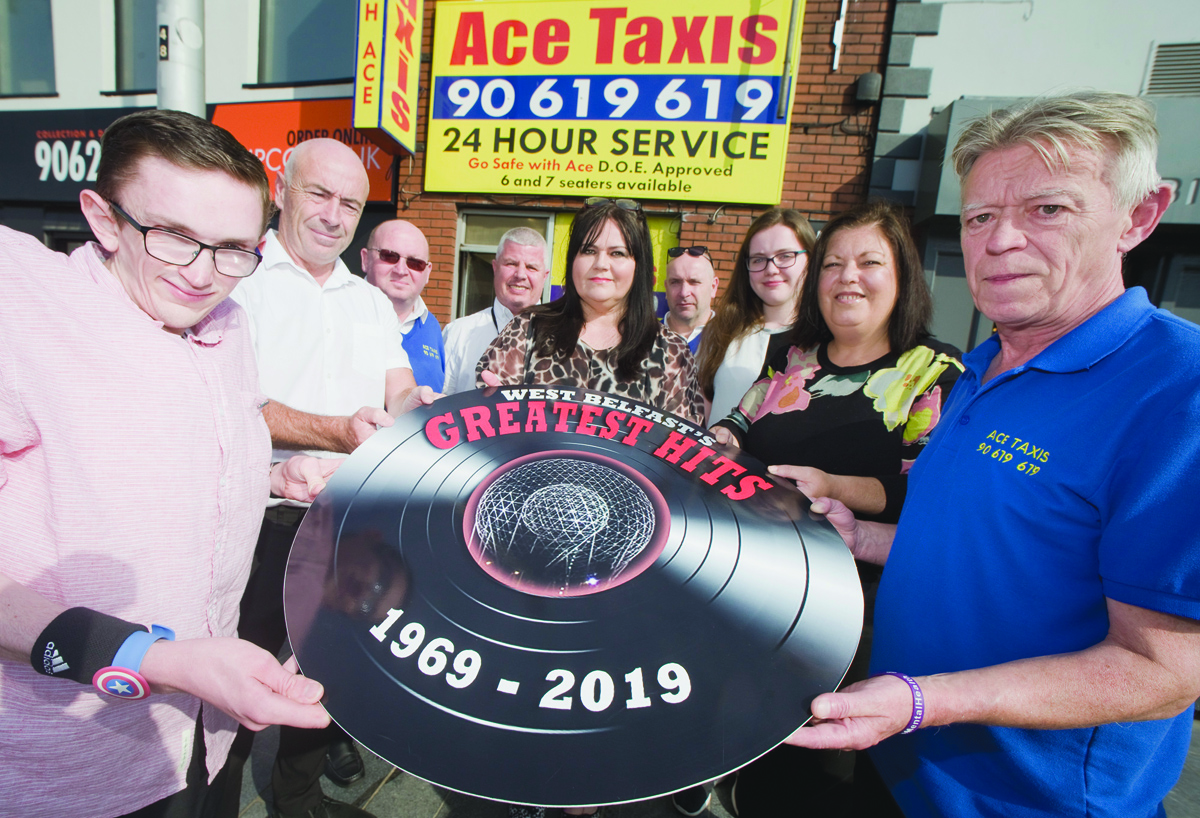 Cathy, Kerry and David Fitzsimons with staff of Ace Taxis, and Jacqueline O\'Donnell from Andersonstown News, second right