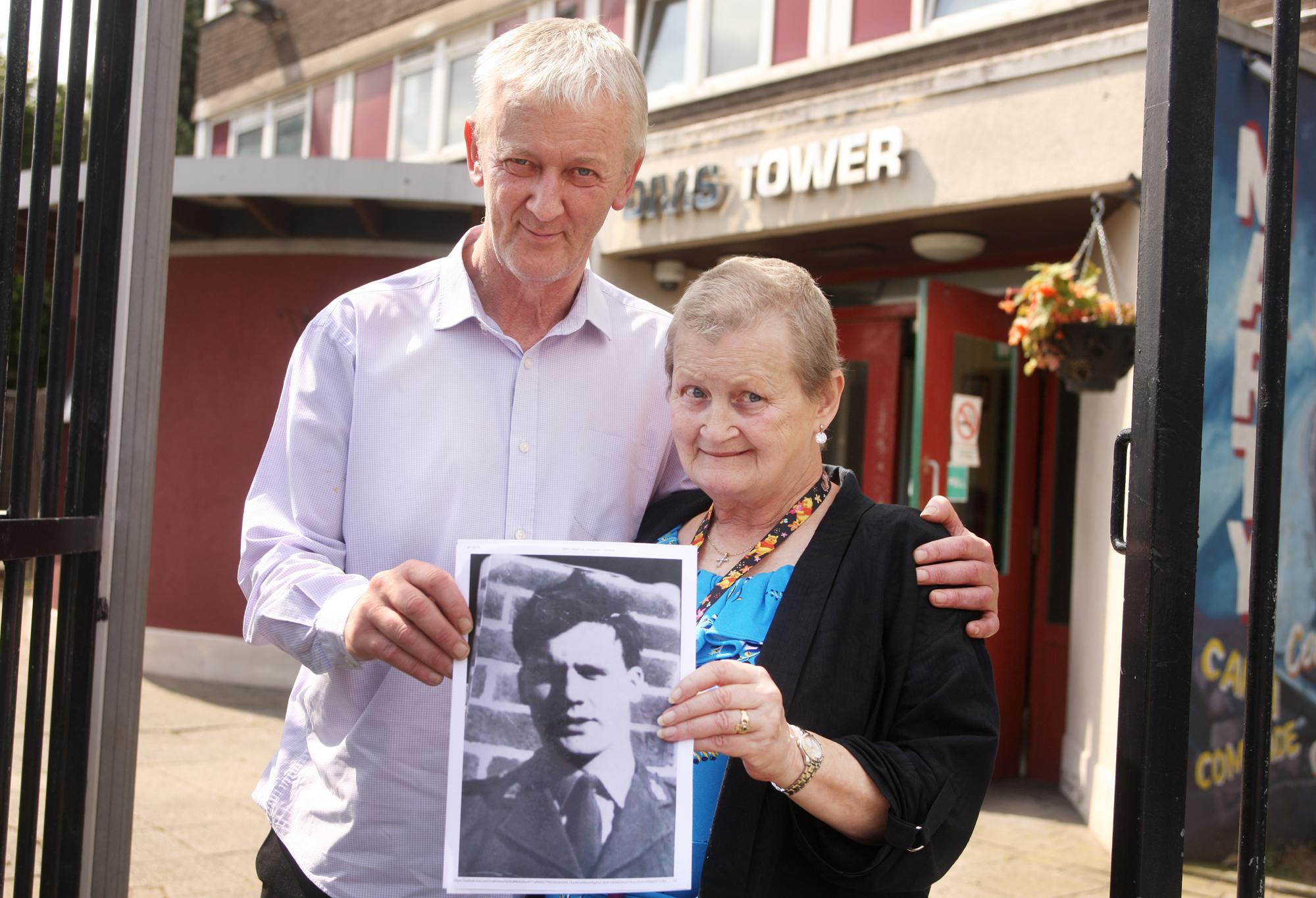 MEMORY: Malachi and Kathleen O’Gormley with a portrait of their cousin Hugh McCabe, shot dead in Divis Flats in August 1969\n