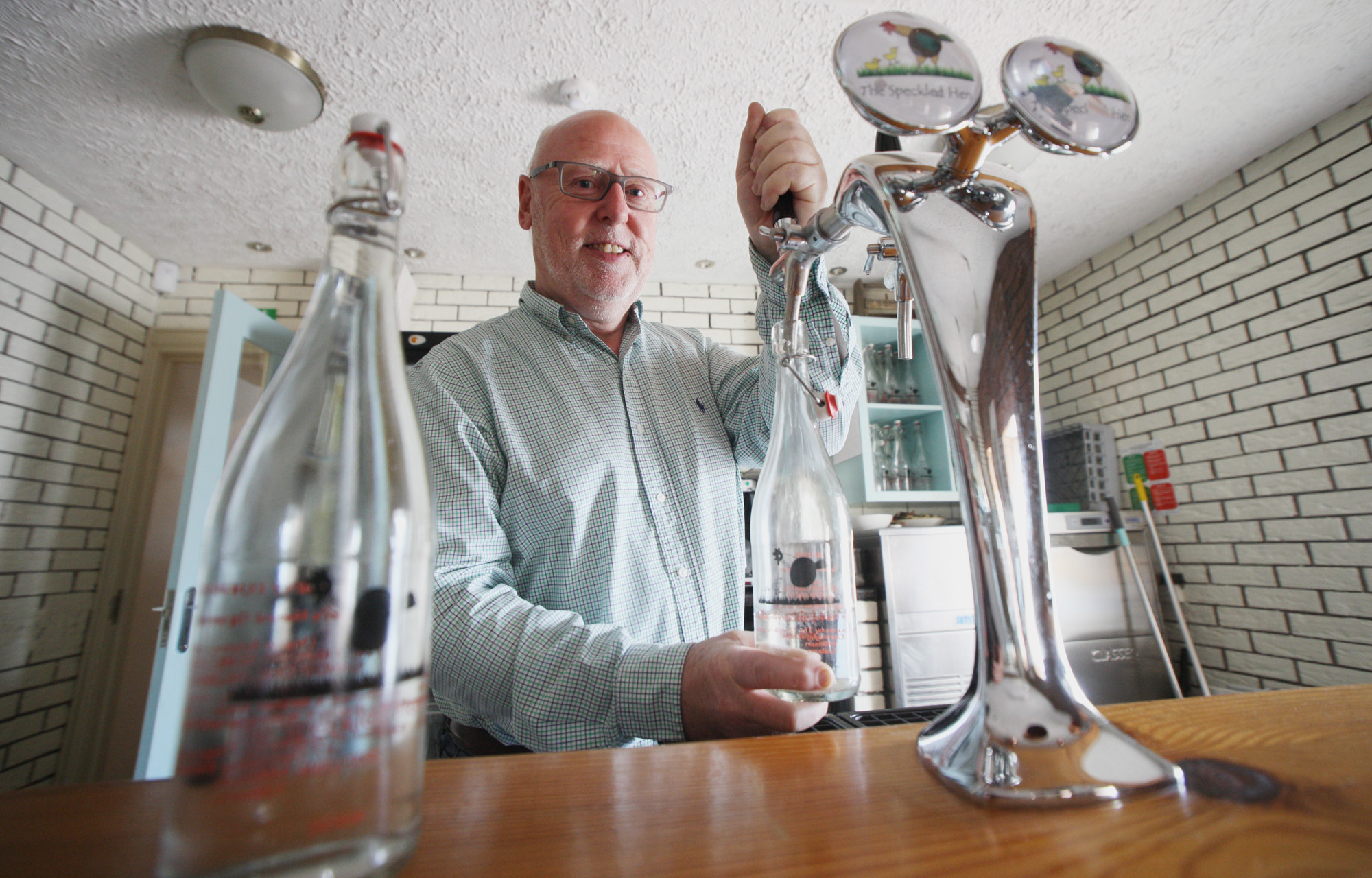NOW THAT’S FRESH: Martin Caldwell serves up some of the crisp water at The Speckled Hen\n