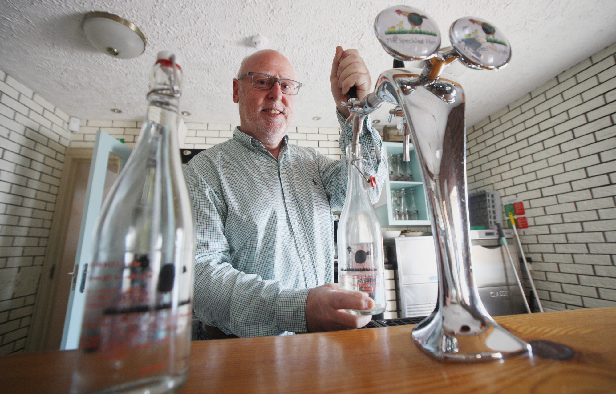 NOW THAT’S FRESH: Martin Caldwell serves up some of the crisp water at The Speckled Hen\n