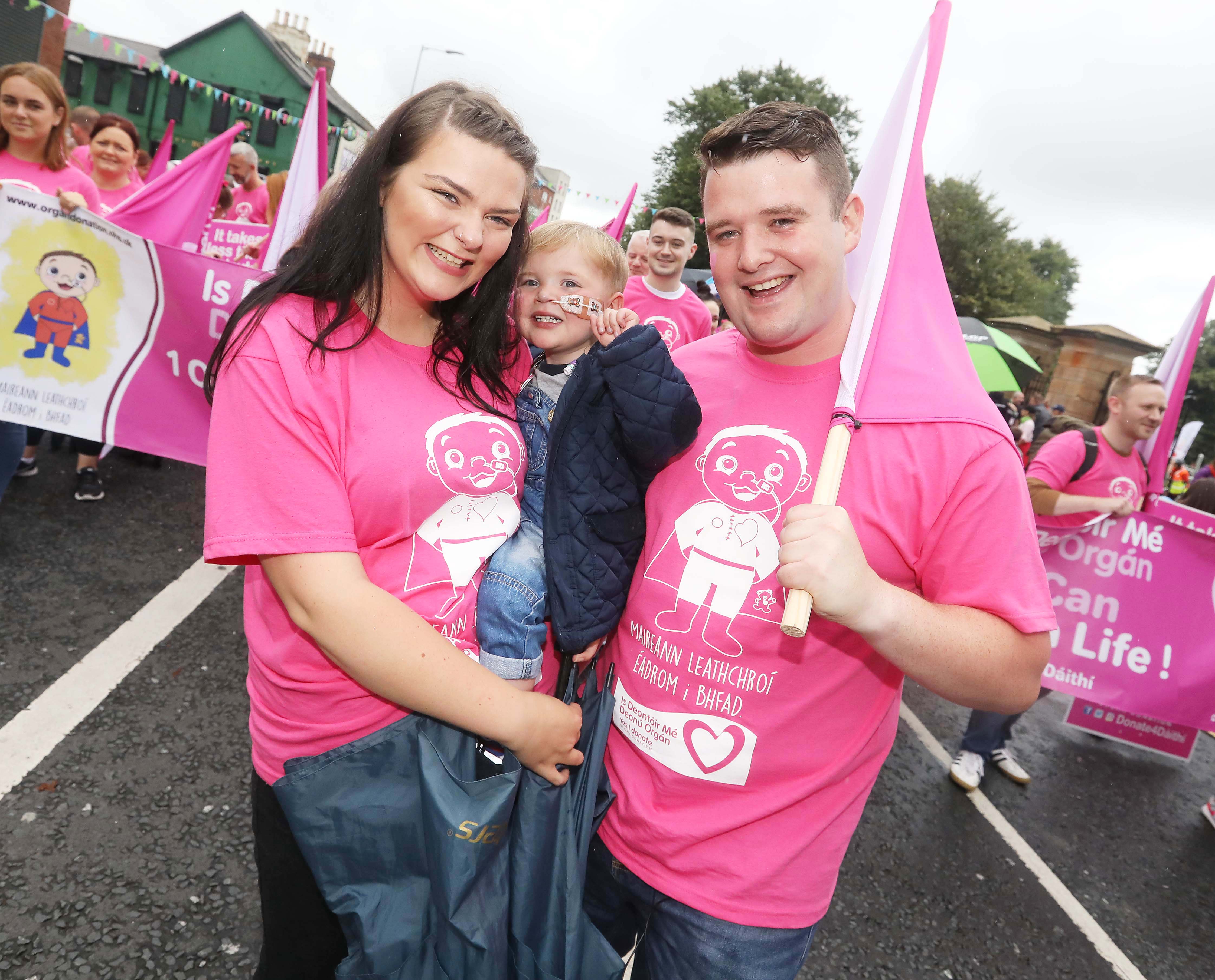 The Falls Road was awash with pink on Saturday for West Belfast toddler Dáithí Mac Gabhann and his parents Máirtín and Seph. The Whiterock two-year-old was grand carnival marshal for the annual Féile an Phobail parade which supported the family’s ‘Is Deontóir Mé/Yes I Donate’ campaign.