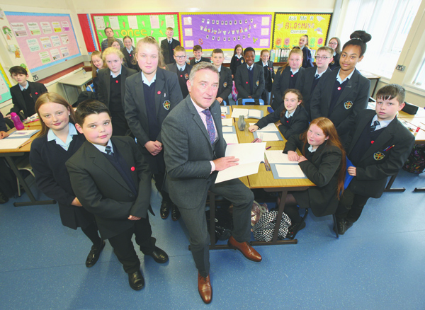 TOGETHER: Martin Moreland, Principal of Mercy College with the latest Year Eight pupils at the school