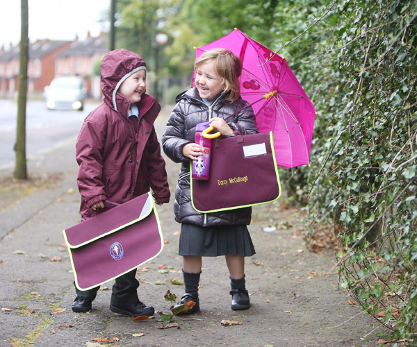 STORMY SCHOOL DAY: Ligoniel Primary School P1\'s Darcy McCullough and Carson Watson make their way to school this week