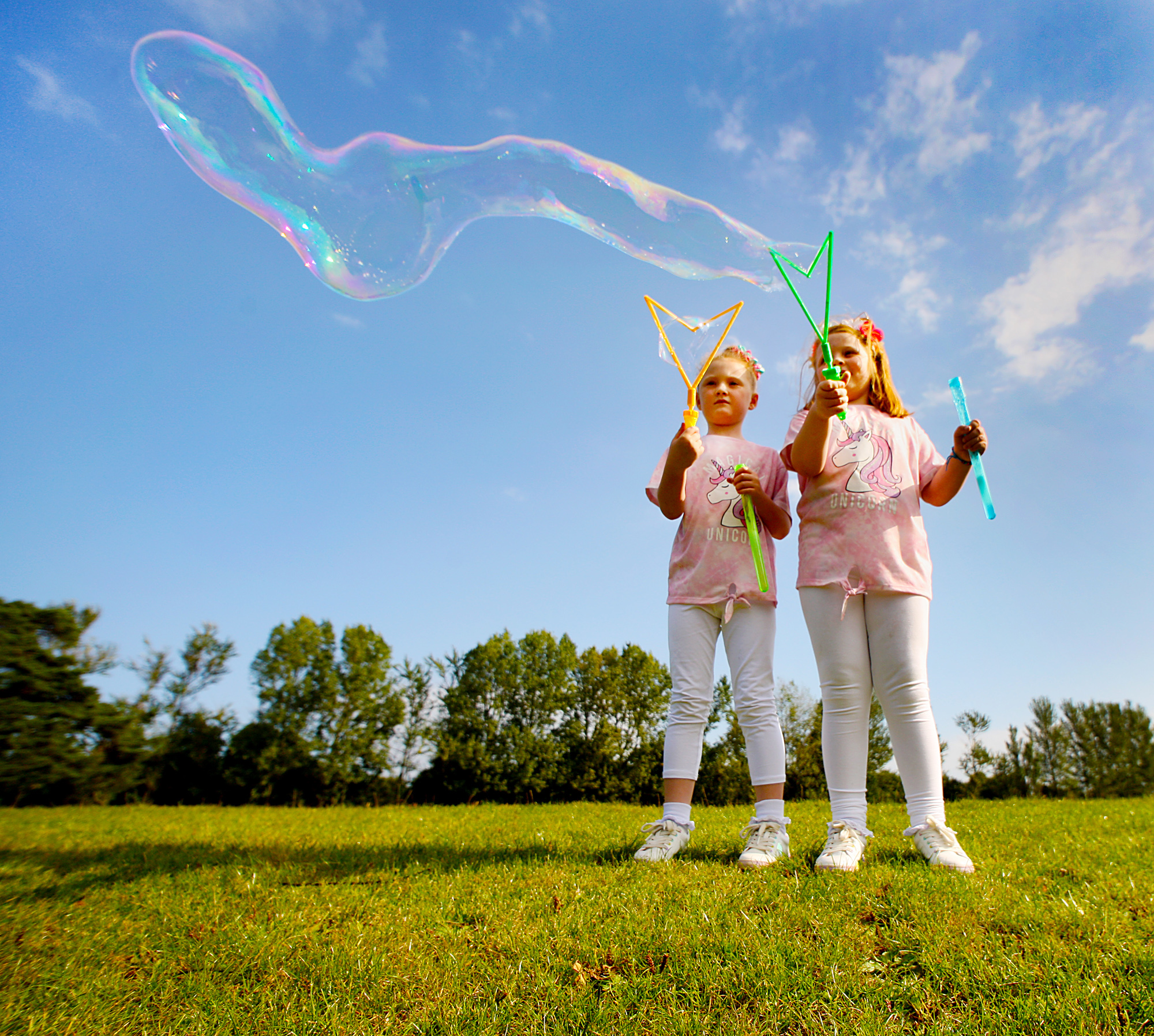 Double bubble in the Falls Park as sisters Mya and Rise Parker enjoy the early summer sunshine