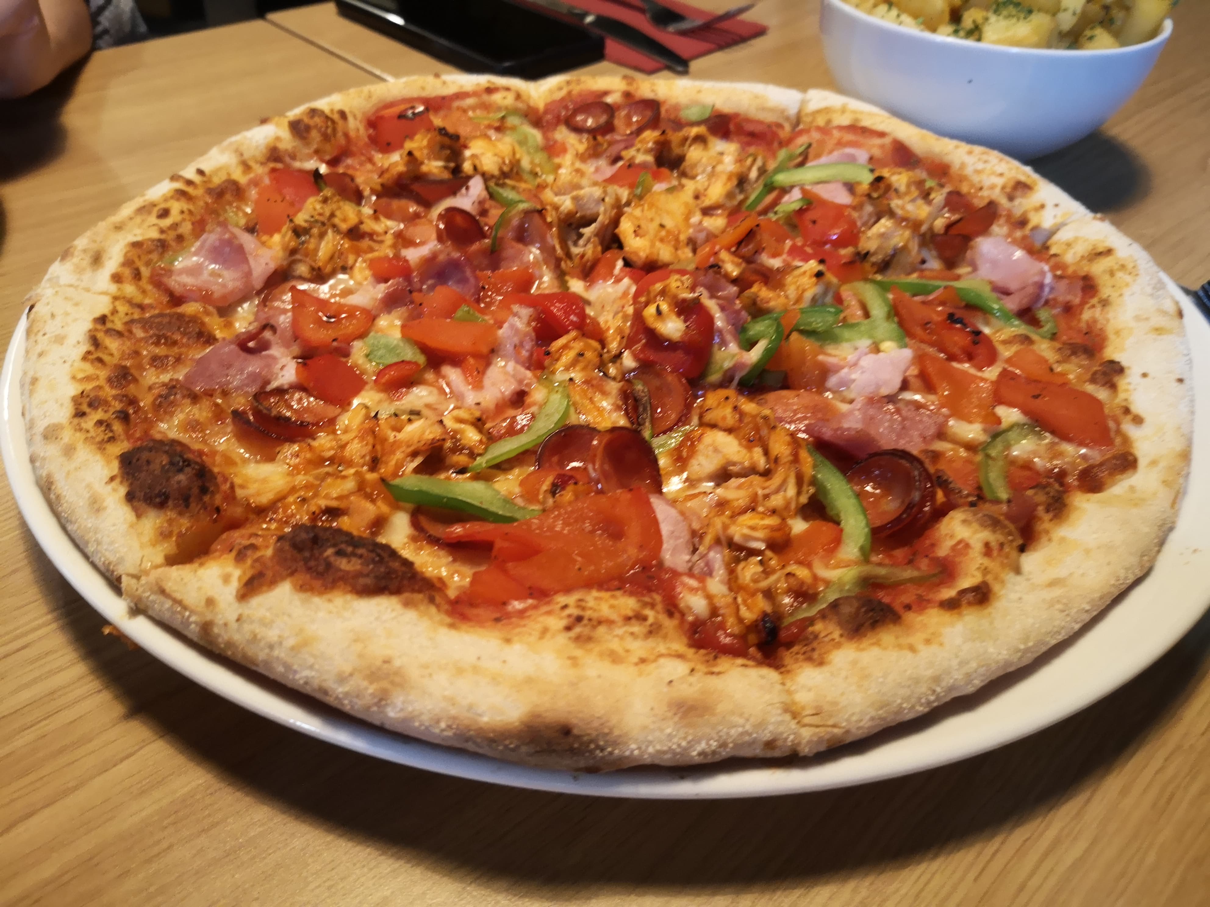 Little O’s pizza with peri peri chicken, bacon pepperoni and peppers