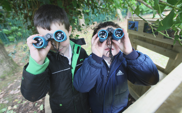 James and Eoin O\'Donnell doing a spot of bird watching in the new eco garden at St. Michael\'s Nursery School