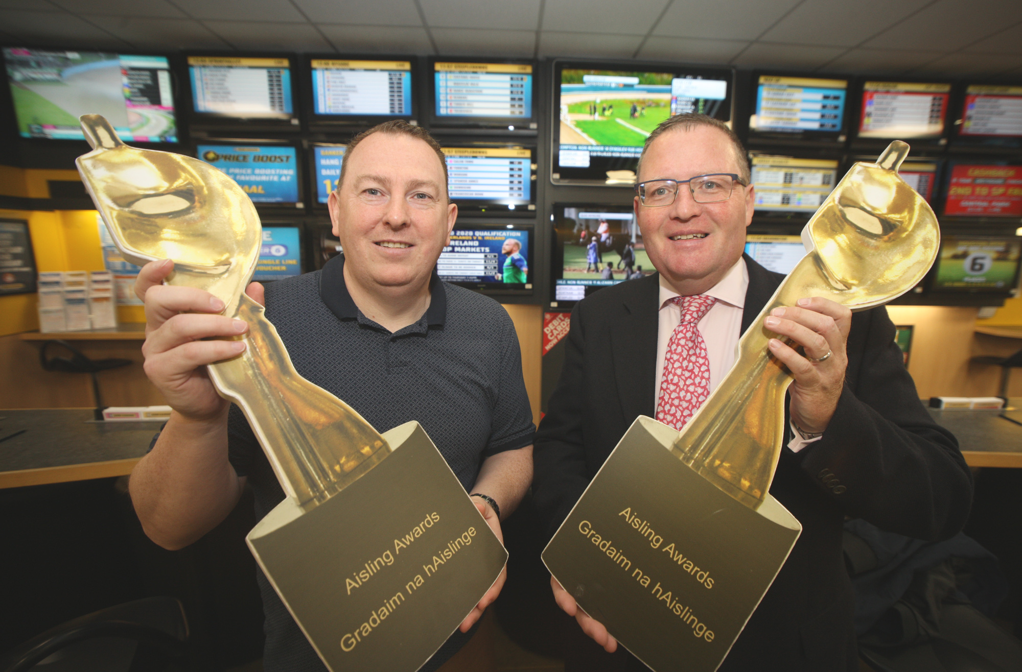 Gerard Mulhern from the Andersonstown News and Brian Graham from Sean Graham bookmakers launch the Aisling Sports Award
