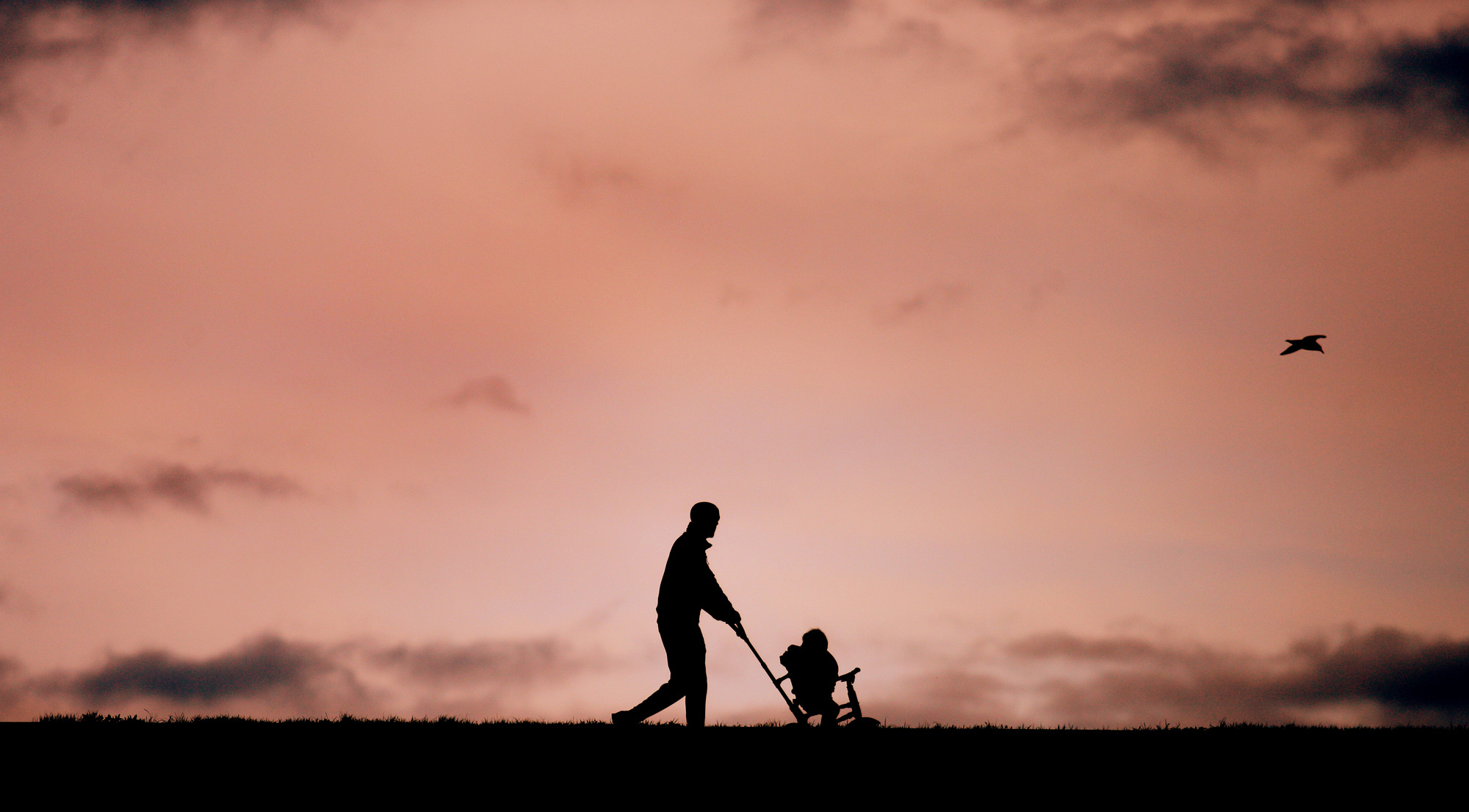 A father and child take an early morning stroll in the Waterworks