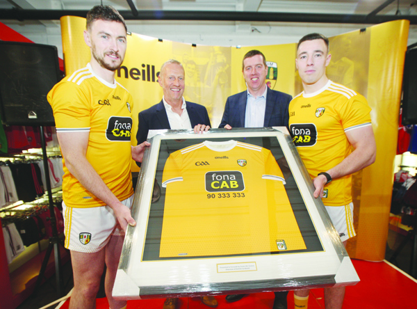 Antrim hurling captain Conor McCann (left) and football captain Declan Lynch (right) with William McCausland of fonaCAB and county chairman Ciaran McCavana at the launch of fonaCAB’s sponsorship of Antrim GAA for the next three years