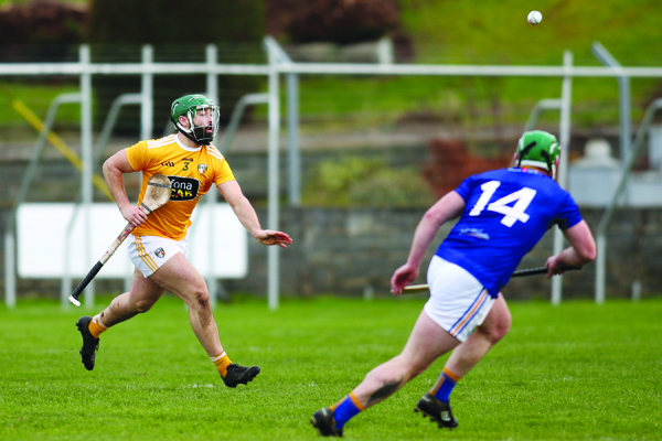 Antrim defender Ciaran Johnston clears his lines under pressure from Wicklow full-forward Andy O’Brien during last Sunday’s Division 2A game at Pearse Park, Arklow