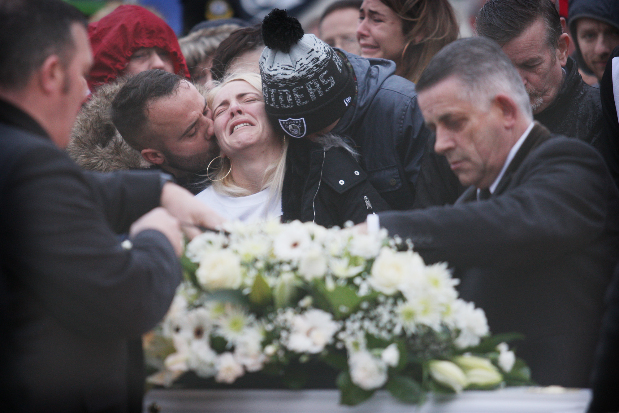 Eoin’s mother Lisa is comforted at her son’s funeral on Tuesday morning 