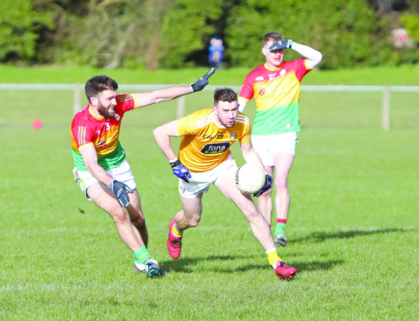 Antrim’s Conor Murray, pictured in action against Carlow’s Shane Redmond during last Sunday’s drawn game at Glenavy, says the Saffrons can’t afford another slip-up against Limerick this weekend  
