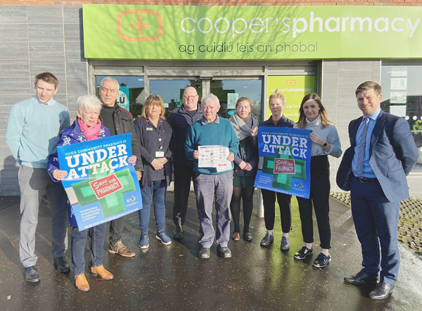 SUPPORT: Michael Cooper and Pat Sheehan MLA with Cooper’s staff and customers as the prospect of strike action looms