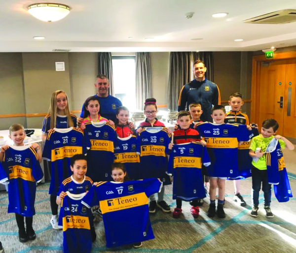 Ballymacward pupils with their jerseys that were presented by Tipperary manager Liam Sheedy and captain Seamus Callanan