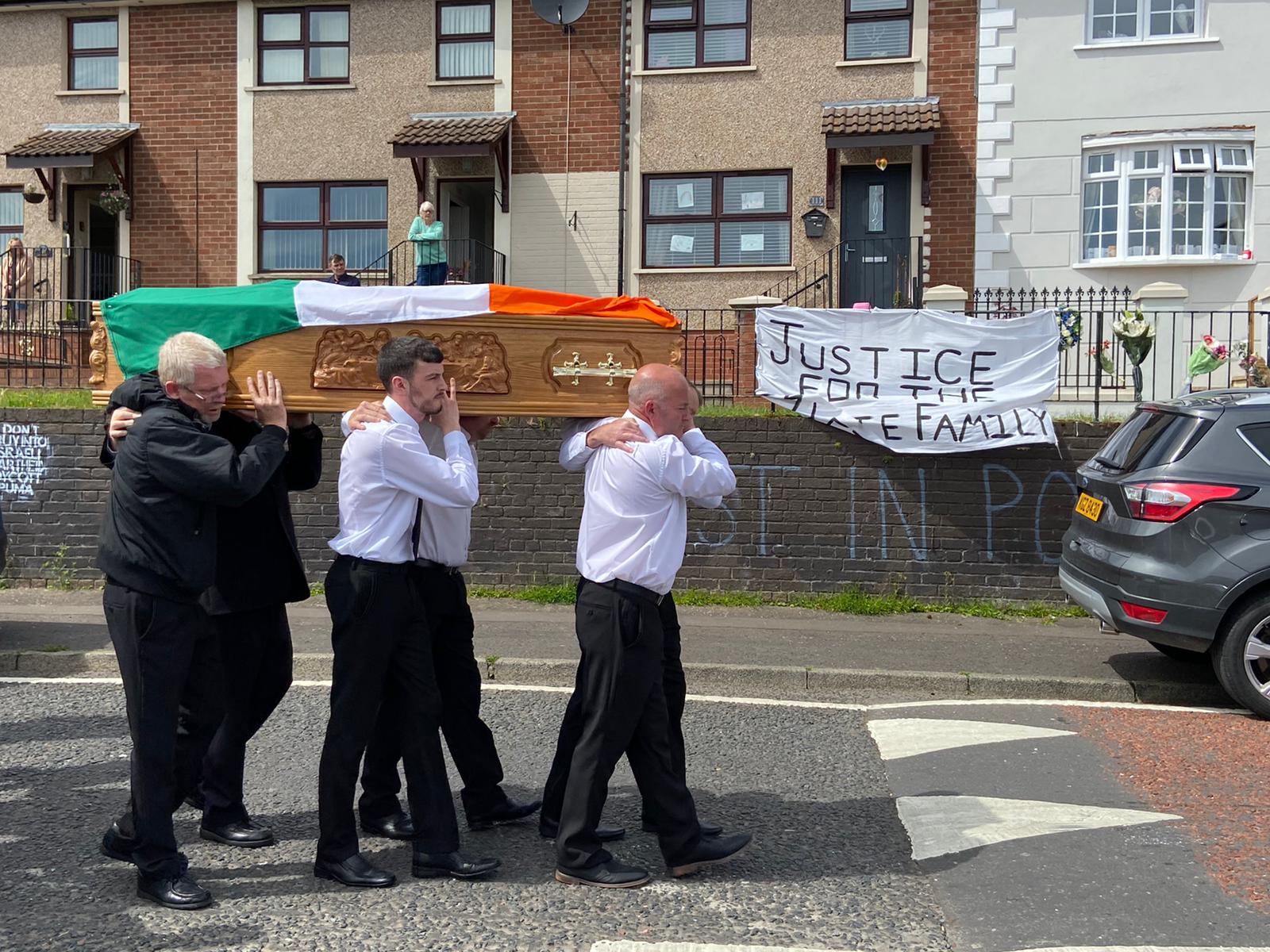 FINAL JOURNEY: The coffin of Kieran Wylie is carried past his home