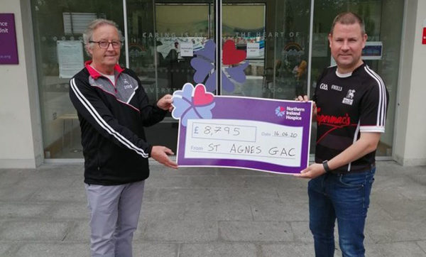 St Agnes’ chairman Frank Caldwell with Chris Ward handing over a cheque for £8795 to the NI Hospice following the club’s ‘Get Fit for the Hospice Challenge’