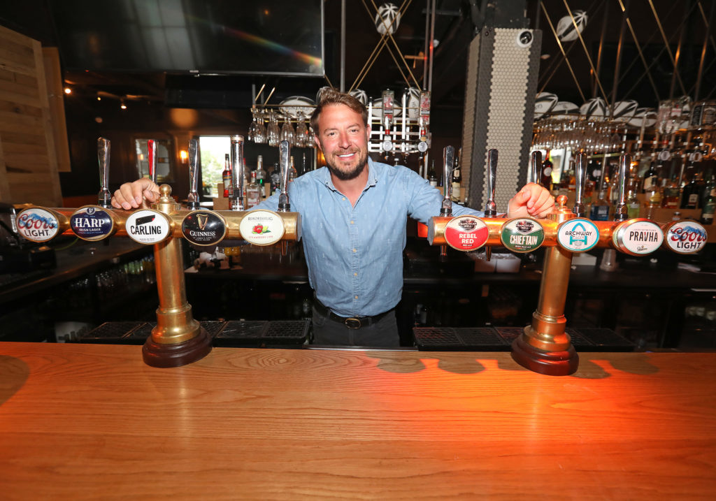 RARIN' TO GO: Jim Conlon behind the pumps at the Devenish