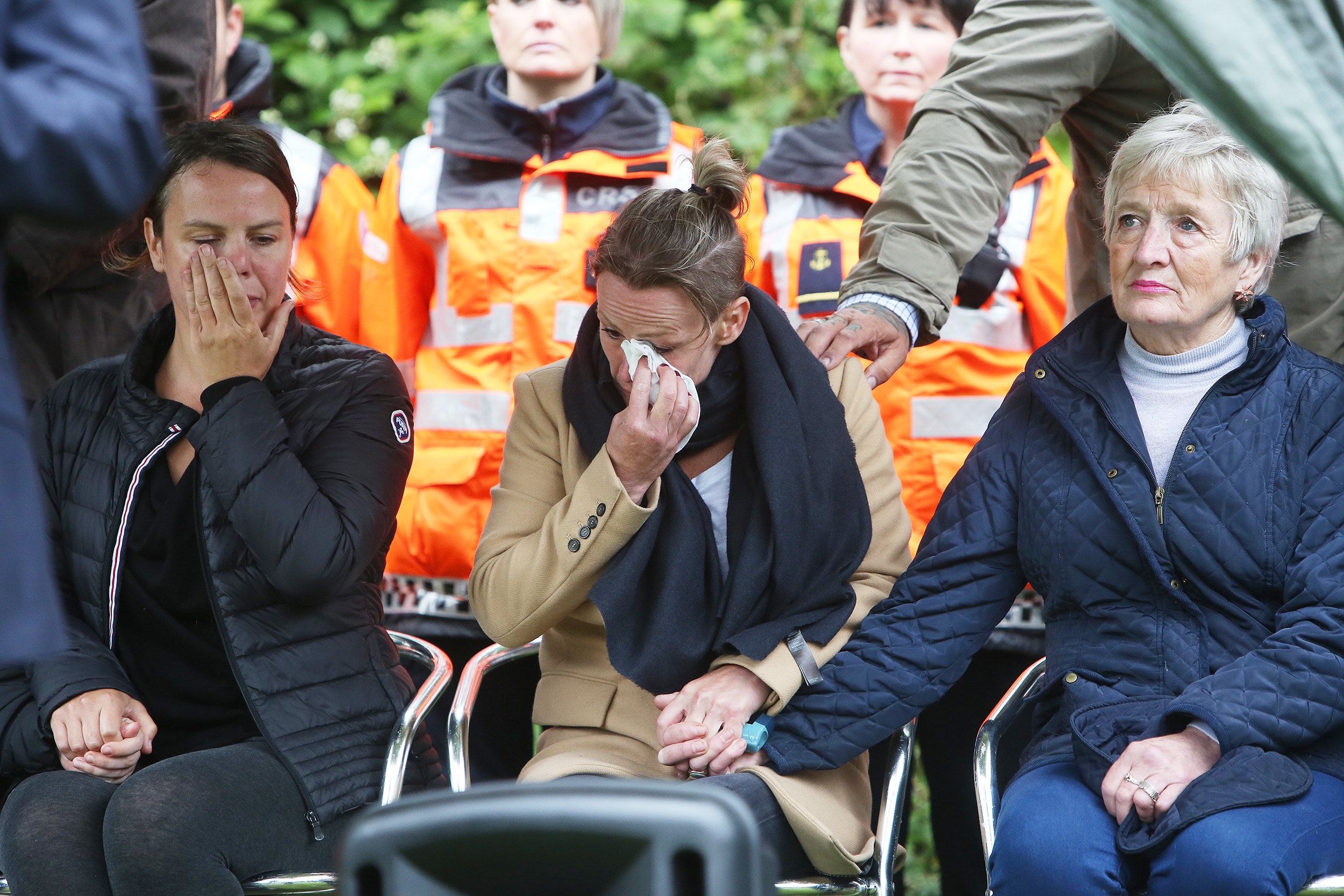 HEARTBREAK: Noah\'s aunts are comforted at the Grove Playing Fields vigil last night. 